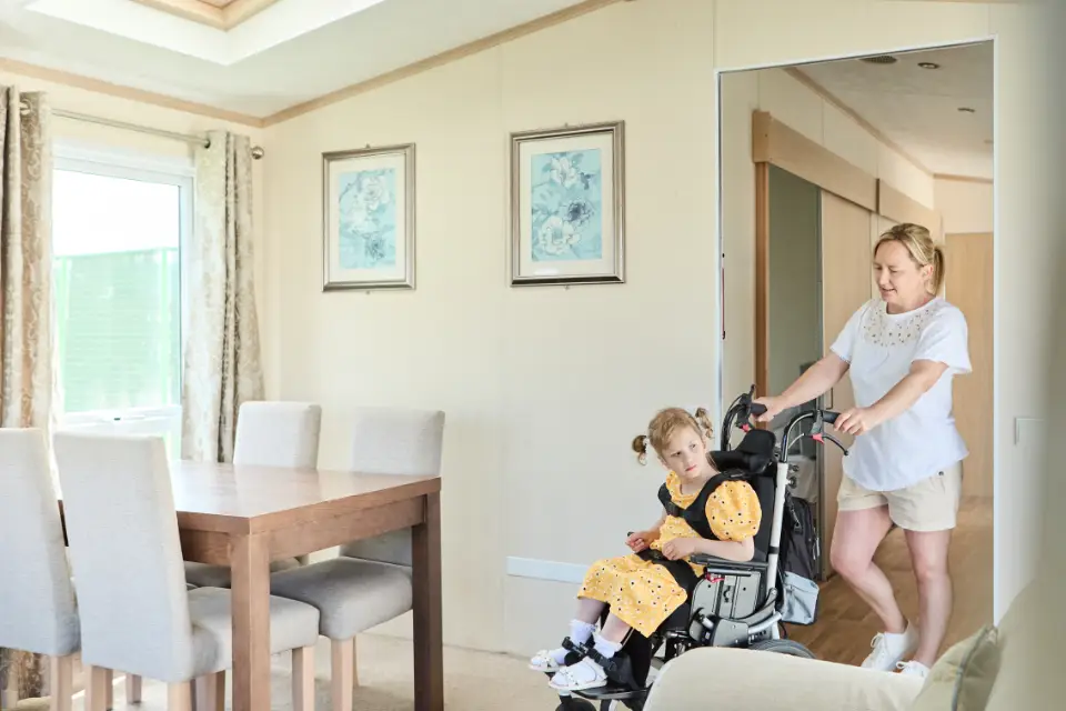 Young disabled girl touring her uk disabled holiday caravan