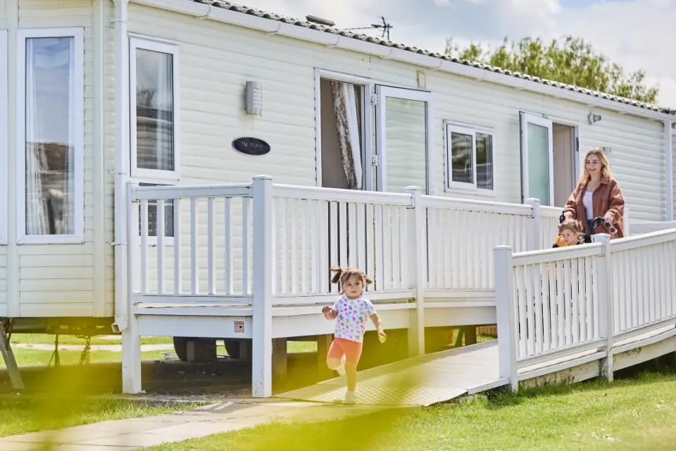 Young family with disabled daughter using disabled holidays caravan ramp