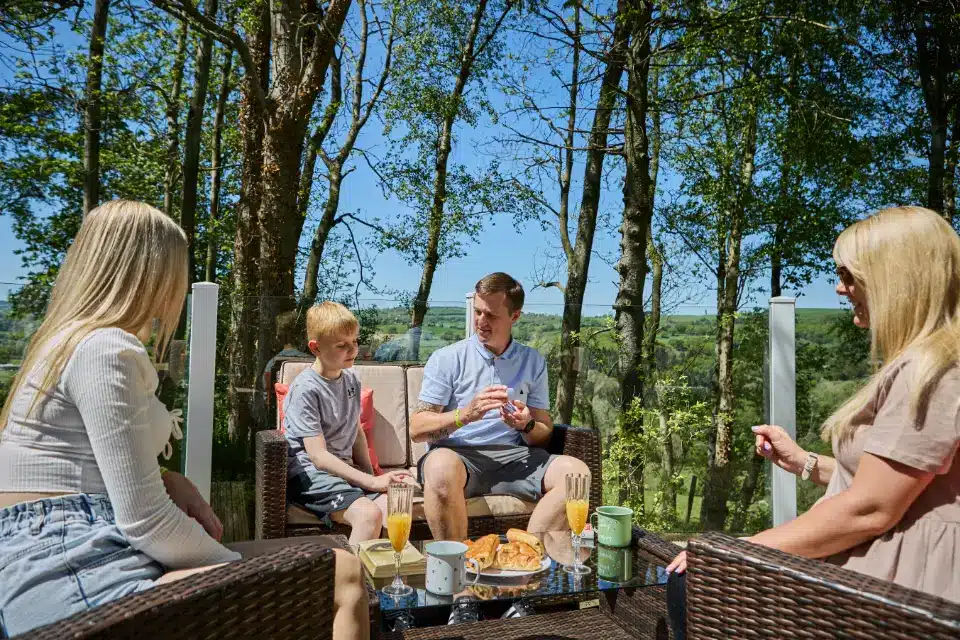 Family enjoying their forest countryside holiday at Woodlands Hall Holiday Park