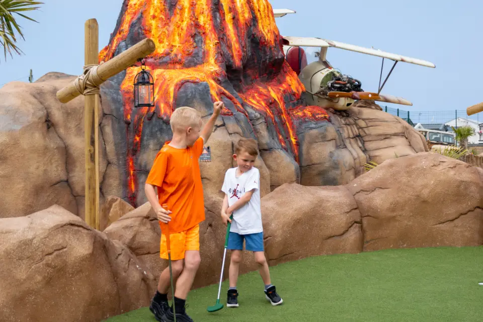 Children playing safari adventure golf in Towyn North Wales